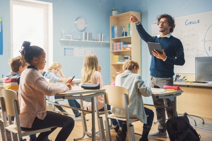 Teacher in a classroom of students